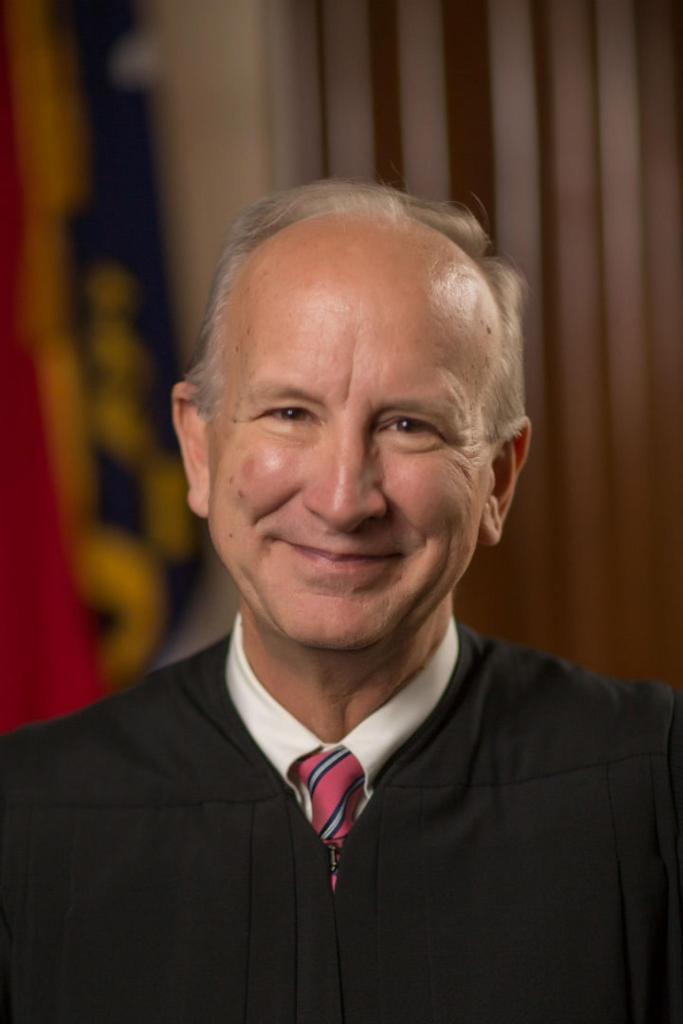 North Carolina Supreme Court Chief Justice Paul Newby poses in judicial robe.