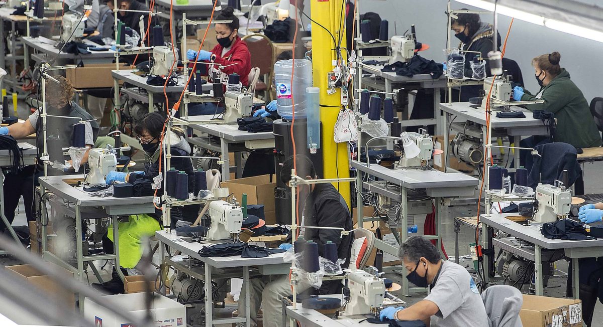 Several workers in the garment industry sew masks to meet the coronavirus demand.