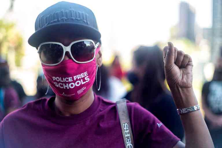 Students, parents, teachers and community members belonging to Reclaim Our Schools in Los Angeles call on the school board to abolish the LAUSD School Police during a protest in 2021. 